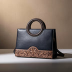  Sac cabas Heritage Vintage en cuir pleine fleur patiné, silhouette souple et structurée, avec finitions métalliques couleur canon de fusil. 