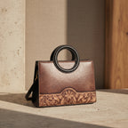  Sac cabas Heritage Vintage en cuir pleine fleur patiné, silhouette souple et structurée, avec finitions métalliques couleur canon de fusil. 